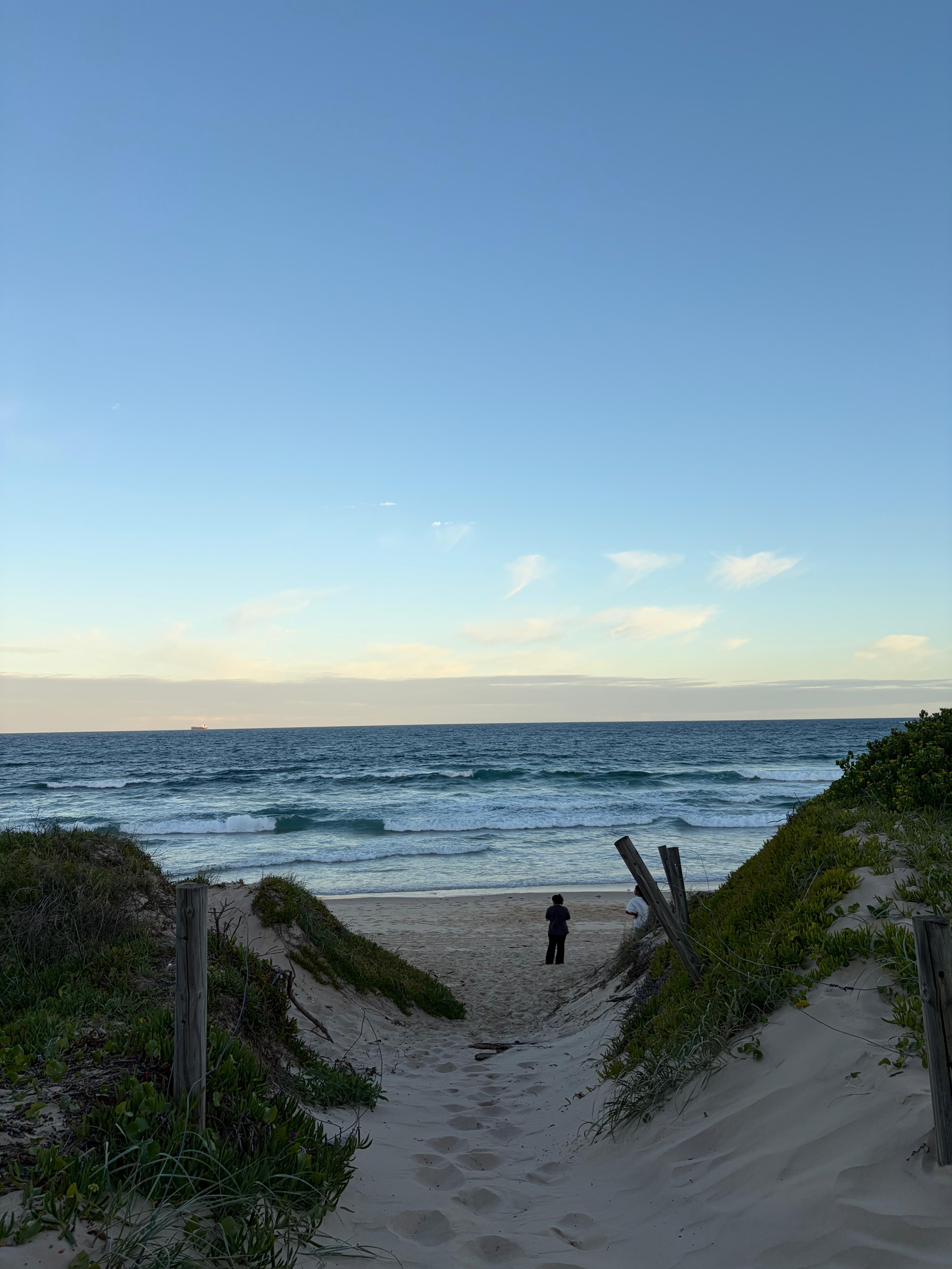 A sandy track through the dunes to the water